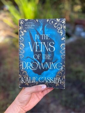 In The Veins of the Drowning by Kalie Cassidy - Blue Cover